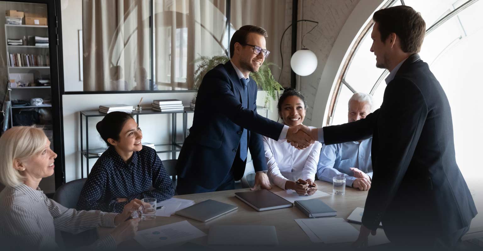 Business meeting with two lawyers shaking hands